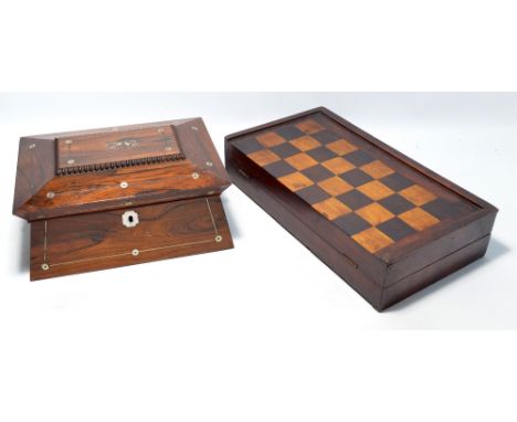 An early 20th century rosewood work box with mother of pearl inlay, twin handles and shaped hinged lid enclosing pull-out tra