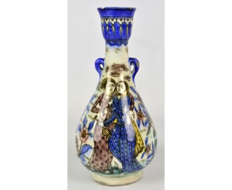 A Persian/Turkish baluster vase with small twin handles, decorated with a figural scene and with birds and flowers, height 26