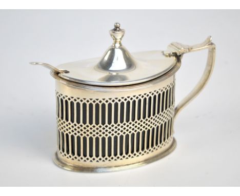 HASELER BROS; an Edward VII hallmarked silver mustard pot of oval form with pierced sides, angled handle and cast urn shaped 