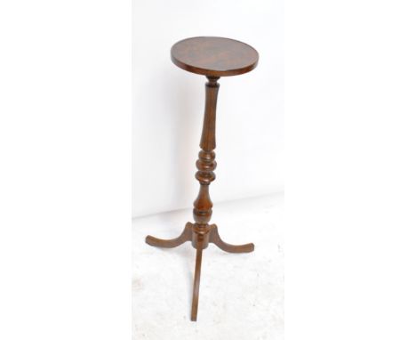 A torchere stand with burr walnut circular top, ring turned central column and three fluted outswept supports, height 96cm, d
