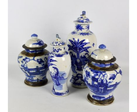 A pair of late 19th/20th century Chinese crackle glazed porcelain baluster ginger jars and covers with character marks to bas