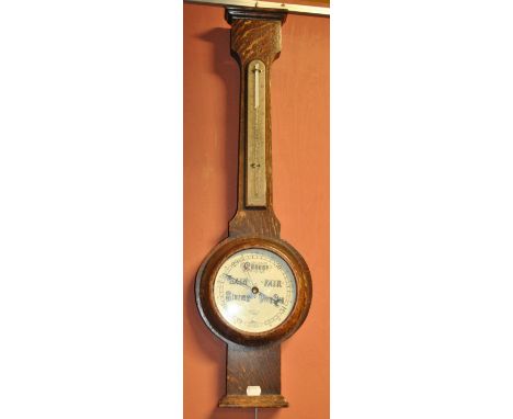 An early 20th century oak cased banjo thermometer and barometer, the circular dial with manufacturer's stamp 'Short & Mason L