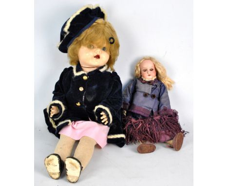 An early 20th century bisque headed Armand Marseille doll marked '390A50XM' with open/close eyes and open mouth showing four 