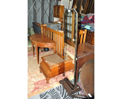 An early 20th century cheval mirror on stepped oak base, height 143cm and a Victorian mahogany commode with embroidered top, 