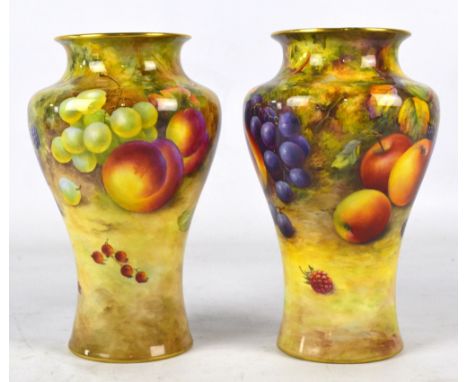A pair of Royal Worcester baluster vases with flared gilt decorated rim, painted with fruit, one signed T Lockyer and the oth