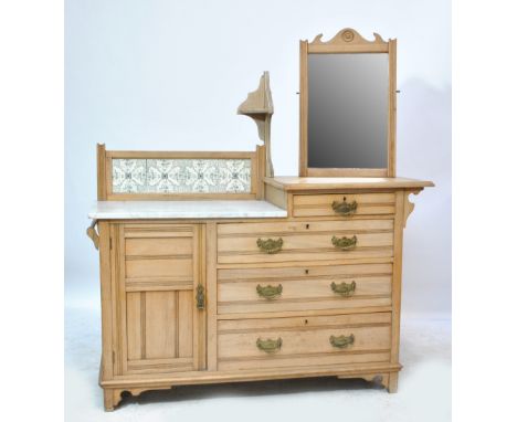 A late Victorian satin walnut washstand with part marble top and ceramic tile decoration over one short, three long drawers a