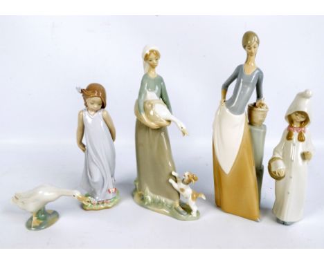 Four Lladro figures; 'Shepherdess with Basket' 4678 (boxed), 'Girl with Goose and Dog' 4866, 'Friend of The Butterflies' 6963