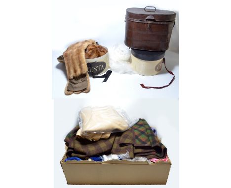 A large quantity of textiles to include three woollen coats, five fur hats, a fur shoulder throw and blue velvet cape/coat wi