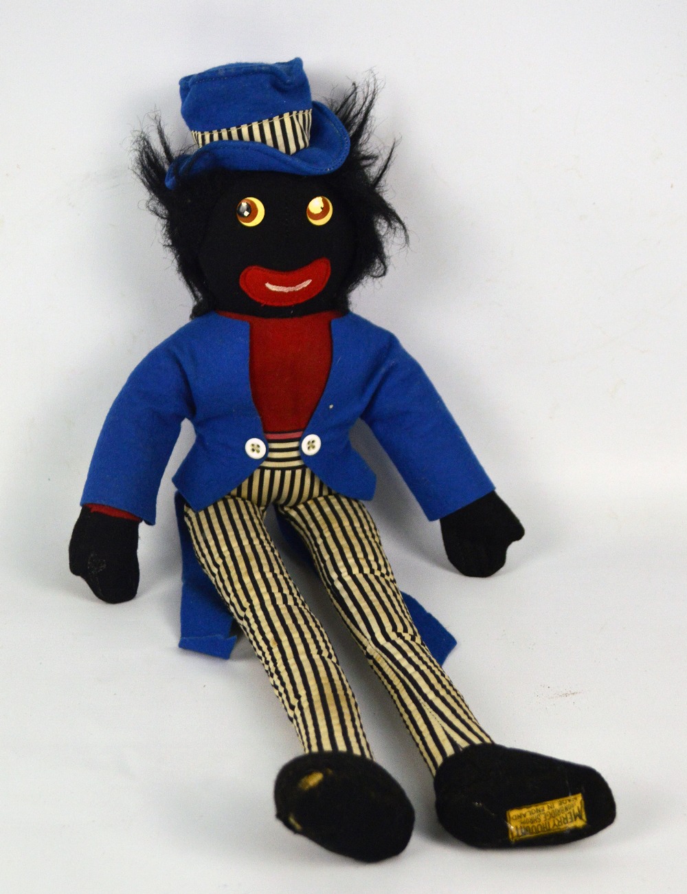 A Merrythought Golly doll in blue coat and hat with pinstripe trousers ...