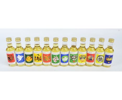 A set of twelve miniature bottles of single Speyside malt scotch whisky with limited edition labels designed by Marieke Teagl