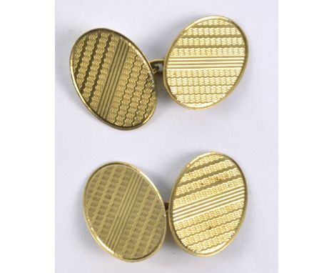 A pair of 9ct yellow gold oval cufflinks with engine turned decoration, approx 5g.