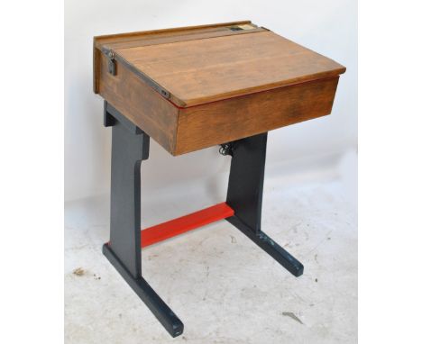 A vintage child's school desk with painted lower section, cork pad and painted interior and a USB port now set where the inks