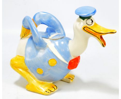 A Wade Heath novelty teapot modelled as Donald Duck, marked to base, length 23cm (af). CONDITION REPORT: The top has been sev