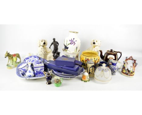 A collection of ceramics including a pair of reproduction Staffordshire dogs, a barge ware teapot, and a quantity of blue and