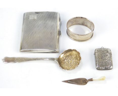 A George V hallmarked silver cigarette case of rounded rectangular form, engraved with initials and with engine turned decora