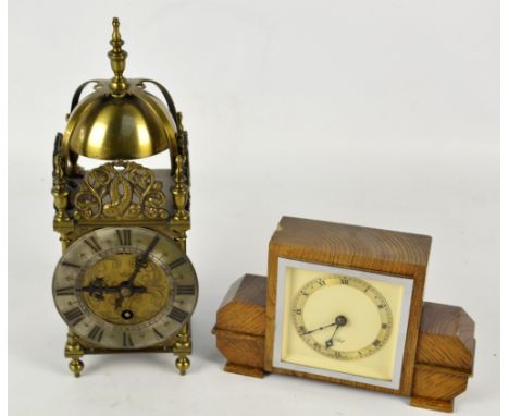 An Elliott early 20th century brass thirty hour lantern clock, the circular dial set with Arabic numerals, diameter 12cm, and