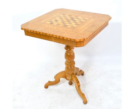 A Continental bleached walnut and inlaid games table with chess board to turned tripod base, width 60cm.