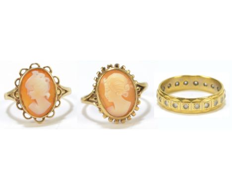 An 18ct yellow gold eternity ring and two 9ct yellow gold cameo rings, combined approx 9.2g.