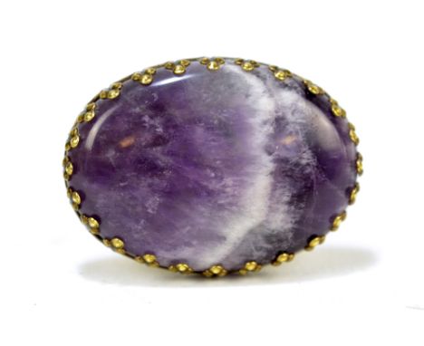 A large oval Blue John ring in base yellow metal settings, 4 x 3cm, size R.