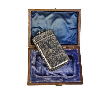 A late 19th century French silver vesta case niello decorated with hunting scene on foliate scroll and floral ground with hin