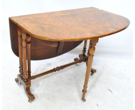 A mid Victorian burr walnut Sutherland table with rectangular top, twin rounded flaps and ring turned legs united by a cross 