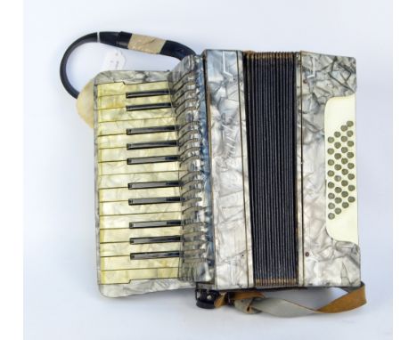 A mid-20th century Mozart accordion with two leather straps.