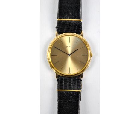 PIAGET; an 18ct yellow gold gentleman's manual wind wristwatch, the circular dial set with baton numerals, diameter 3cm exclu