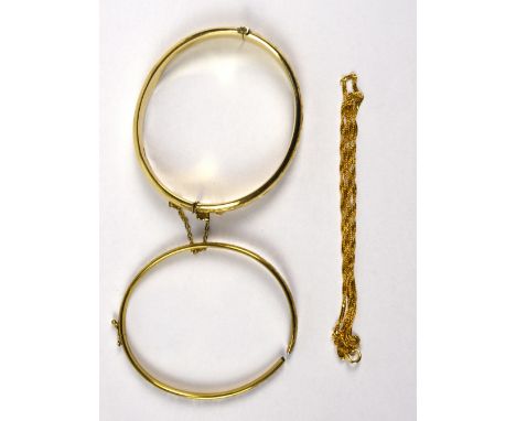 A 9ct yellow gold snap bangle with bright cut decoration, a yellow metal example (af) and a 9ct yellow gold fine rope twist c
