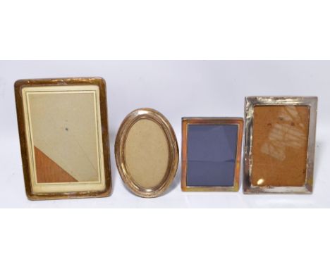 A small collection of hallmarked silver photograph frames comprising a large plain example, Charles S Green, Birmingham 1918,