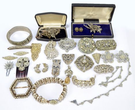 A group of costume jewellery, each piece set with cubic zirconia to include Art Deco brooches, a pendant, clips and a bangle,