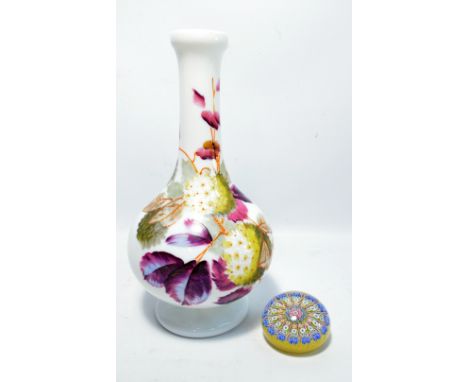 A Perthshire glass floral decorated paperweight, and a Victorian white opaque glass bottle vase painted with floral motifs, h