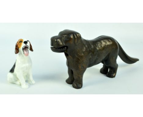 A bronzed nutcracker in the form of a dog, length 30cm, and a Royal Doulton figure of a seated dog HN1099 2).