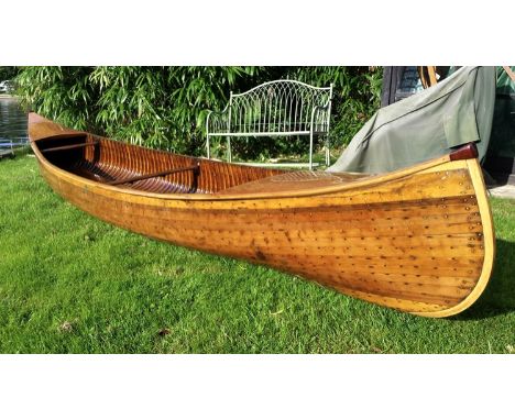 A rare late 19th century Canadian Canoe Company of Peterboro Ontario cedar and copper stud canoe, bearing maker's plaques, 14