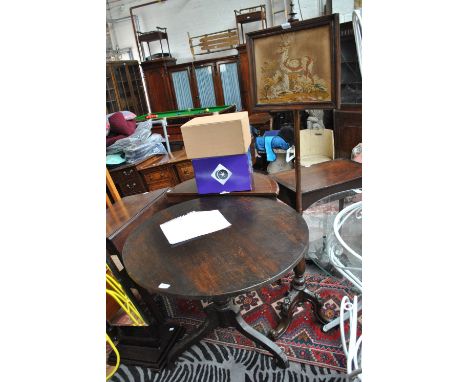 A 19th century walnut pole screen on tripod supports, also a 19th century oak tilt top tripod table, diameter 85cm (2).