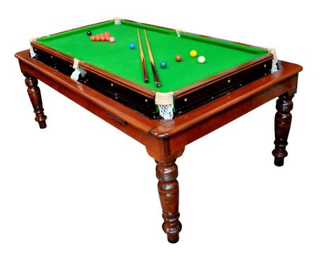 A combination pine and stained beech dining table/billiards table with plank top above slate bedded snooker table with ring t