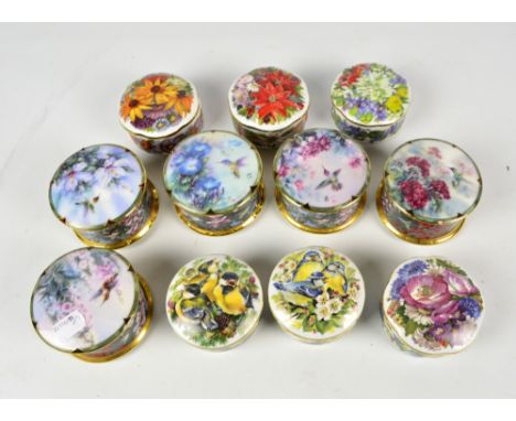 A collection of five limited edition circular ceramic music boxes decorated with humming birds amongst flowers, all diameter 