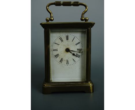 An early 20th Century French carriage clock, 10.5 cm excluding handle
