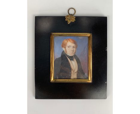 An early 19th Century portrait miniature of a red-headed young man wearing a beetle wing collar with Ascot cravat tie, fawn w