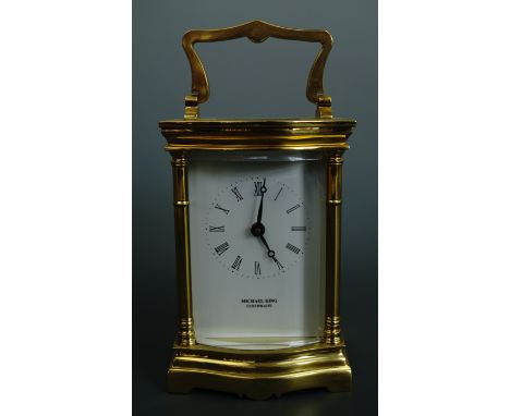 A contemporary carriage clock, retailed by Michael King of Curthwaite, 12 cm excluding handle