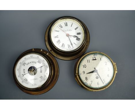 A Smith's Astral marine bulkhead clock, second quarter 20th Century, together with a Foste Callear aneroid barometer and matc