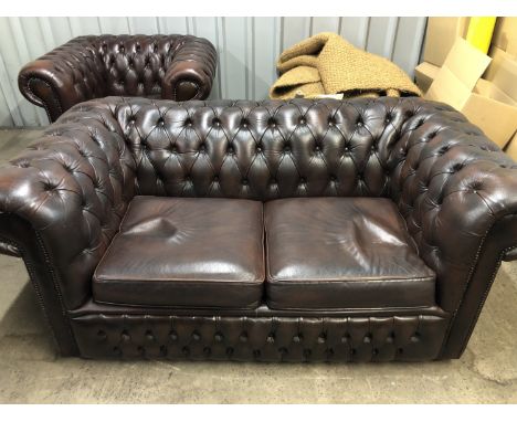 A dark brown deep-button-upholstered hide Chesterfield sofa and armchair, sofa 165 cm wide, 88 cm deep, seat 44 cm high, back