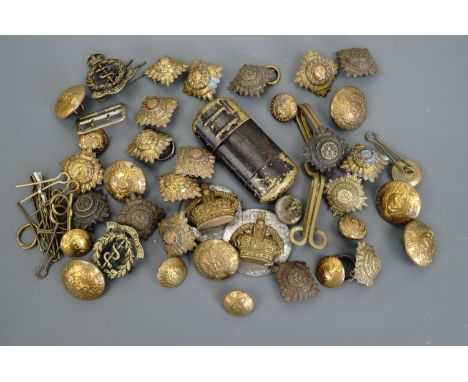 A group of Royal Army Medical Corps officer's insignia together with a Tommy cigarette lighter