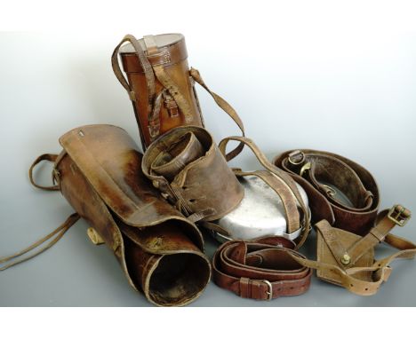 A British army officer's Sam Browne belt and sword frog, together with mess tins, leather gaiters etc
