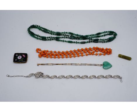 A small group of vintage costume jewellery including a faux-jade heart-shaped pendant