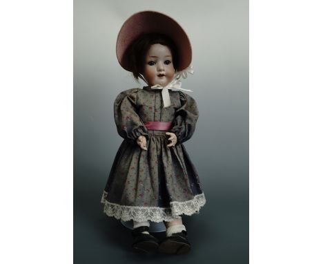 A late 19th / early 20th Century Heubach porcelain doll, having an open mouth and sleeping eyes, 302.3/o, 42 cm