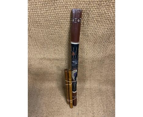 A traditional Australian aborigine didgeridoo, 120 cm, together with three other wind instruments