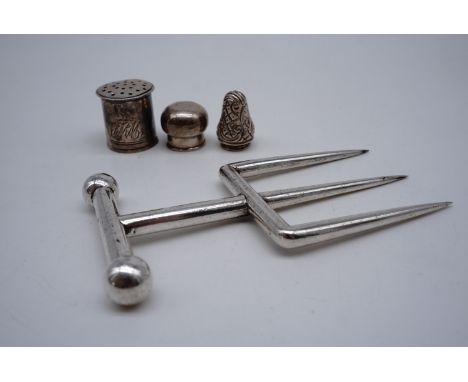 A Victorian electroplate bread fork together with a Georgian engraved white metal caster cap etc