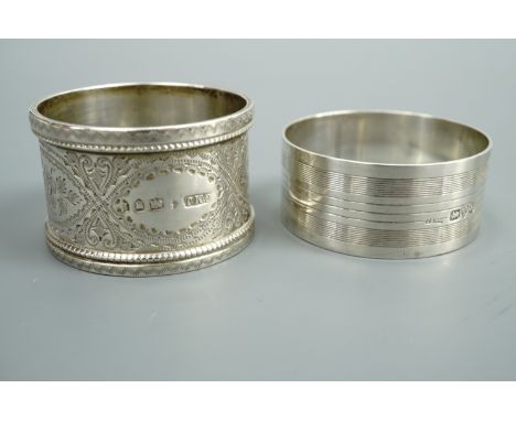 A Victorian engraved silver napkin ring together with a later engine-turned example