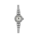MOVADO Damenarmbanduhr, in Weissgold 18K, Lünette mit 24 Brillanten,Handaufzug, Band mit 12