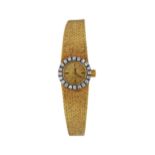 OMEGA Damenarmbanduhr, in Gelbgold 18K, Durchmesser 15 mm, 36,2 gr, Lünette mit 20 Diamanten von